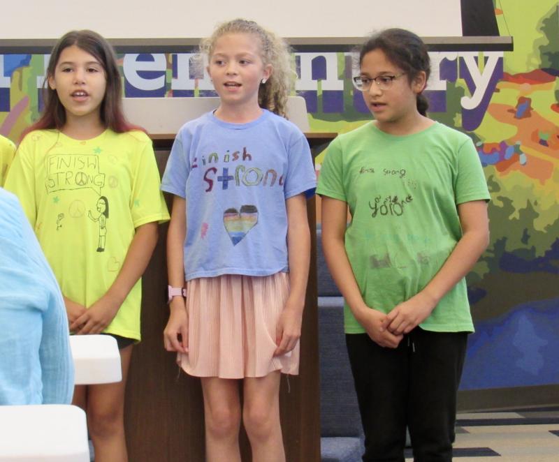 Fourth-graders (l-r) Adaya Boyer, Katie Nauman and Sarai Calderon-Melendez sing about a different healthy habit.